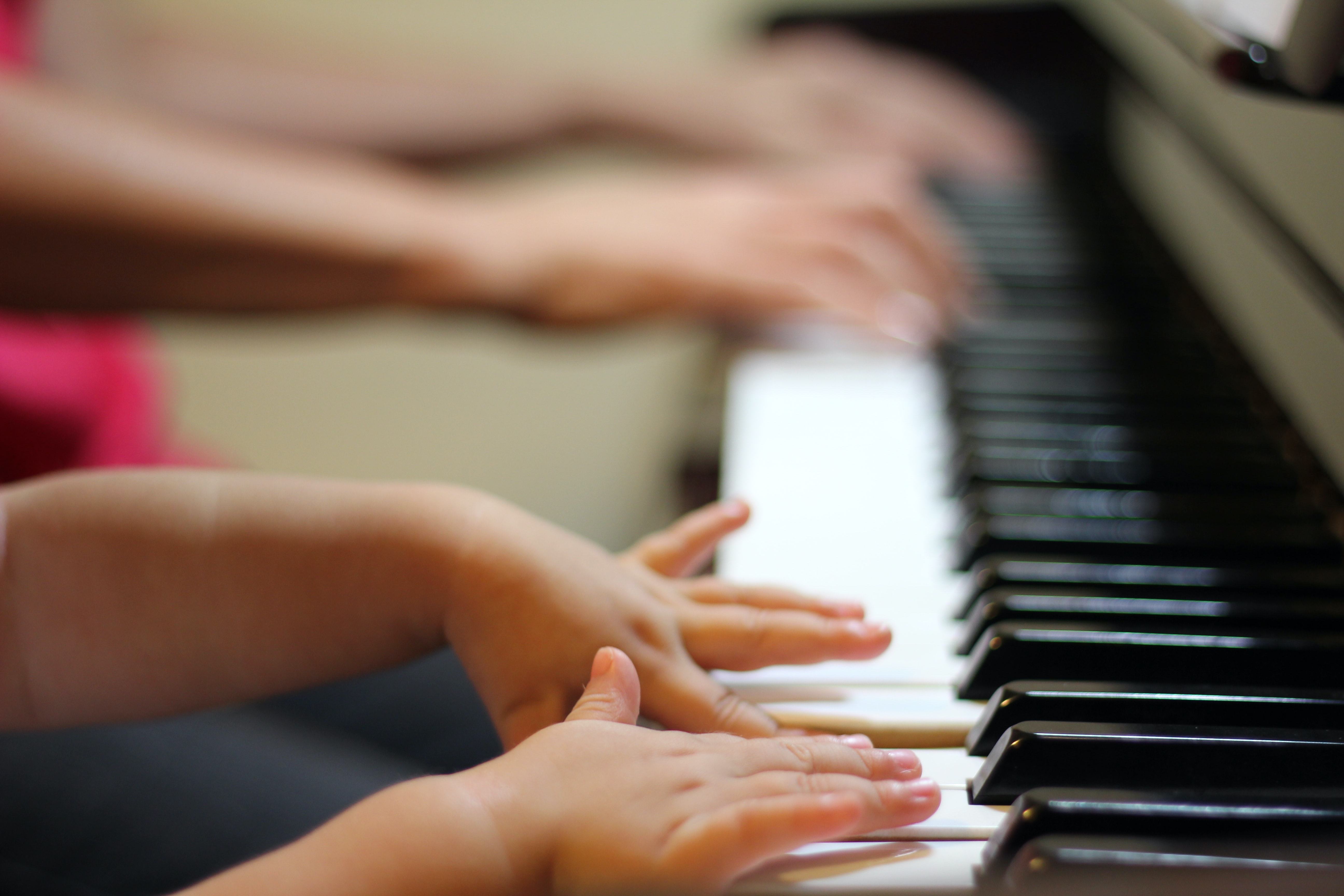 2 sets of hands playing